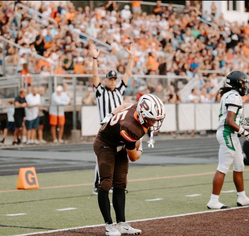 Maks Karasek #25 celebrates in the end zone