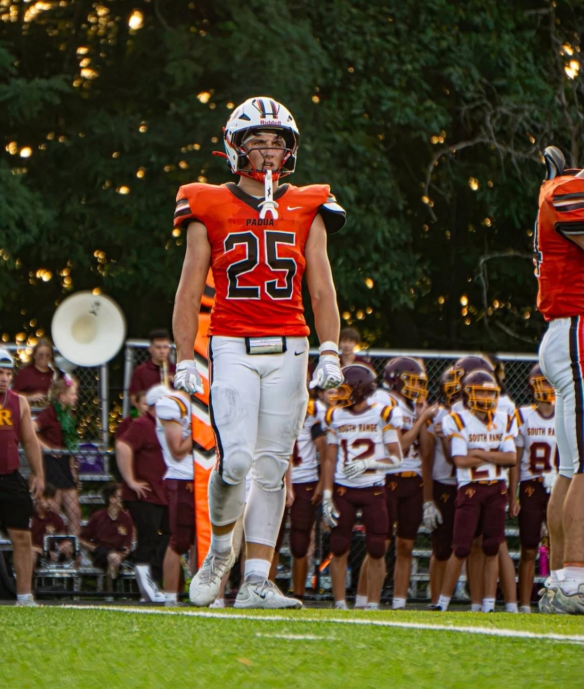 Maks Karasek #25 on the sideline in home orange