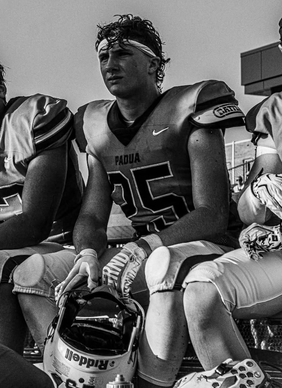 Maks Karasek #25 on the bench, black and white